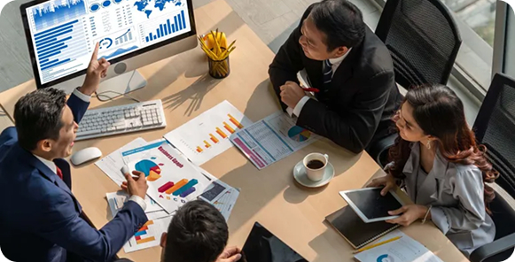 A man sits on a couch using a laptop at a wooden table, surrounded by floating social media icons. The scene conveys a focused and tech-savvy atmosphere.